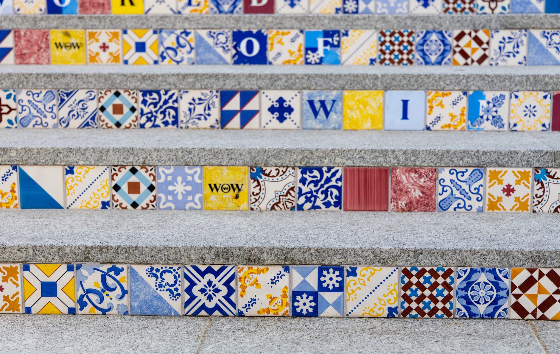 Vibrantly patterned tiles on outdoor steps, showcasing diverse geometric and artistic designs. — Wooden Loft Ladders: The Sma